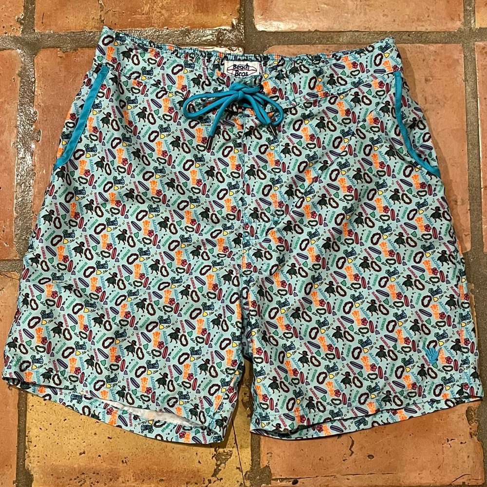 L Beach Bros print swim trunks